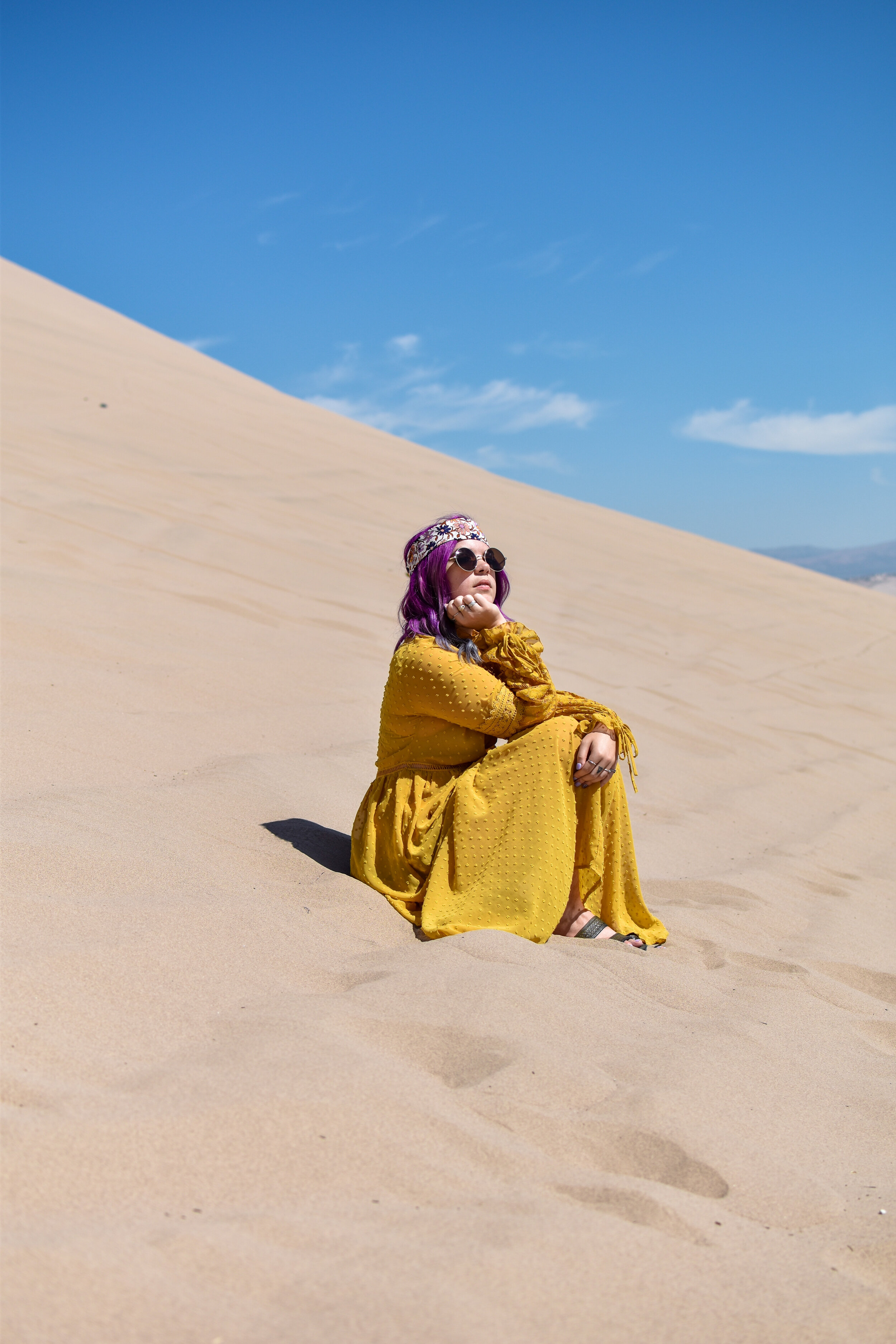 woman sitting at the LITTLE SAHARA SAND DUNES
