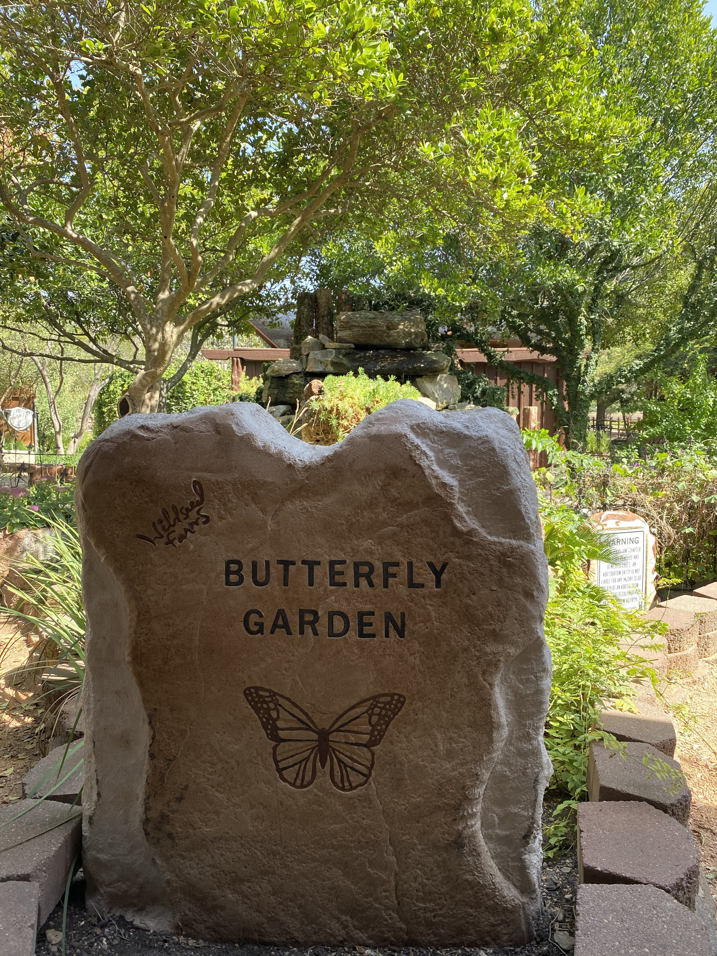 butterfly garden sign engraved in a stone at Fredericksburg