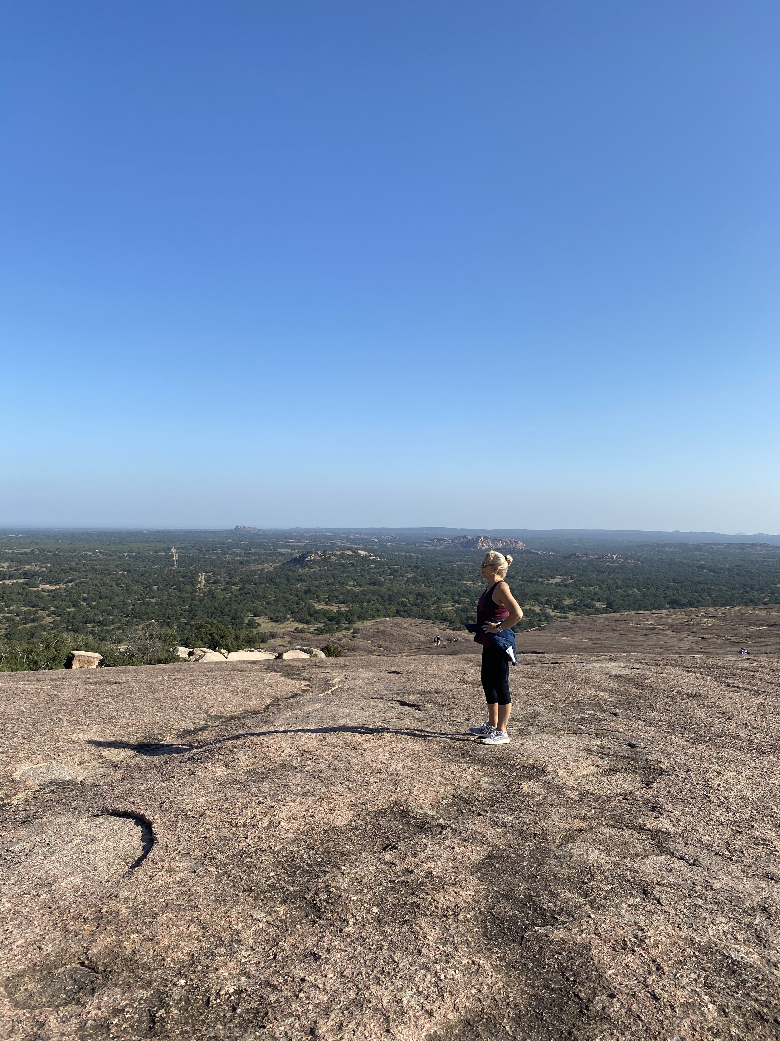 woman standing at the Enchanted Rock
