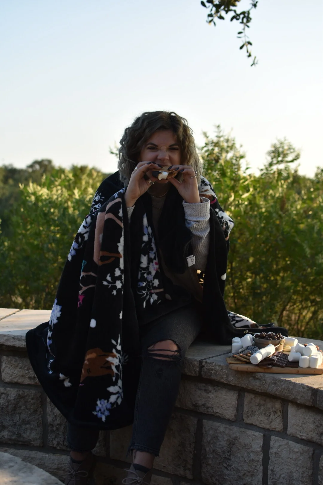 woman eating s'mores