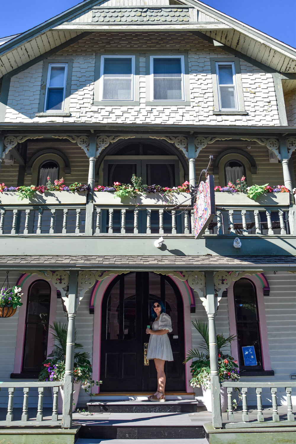 woman standing outside one of the WALKABLE BOUTIQUE HOTEL ON MARTHA'S VINEYARD