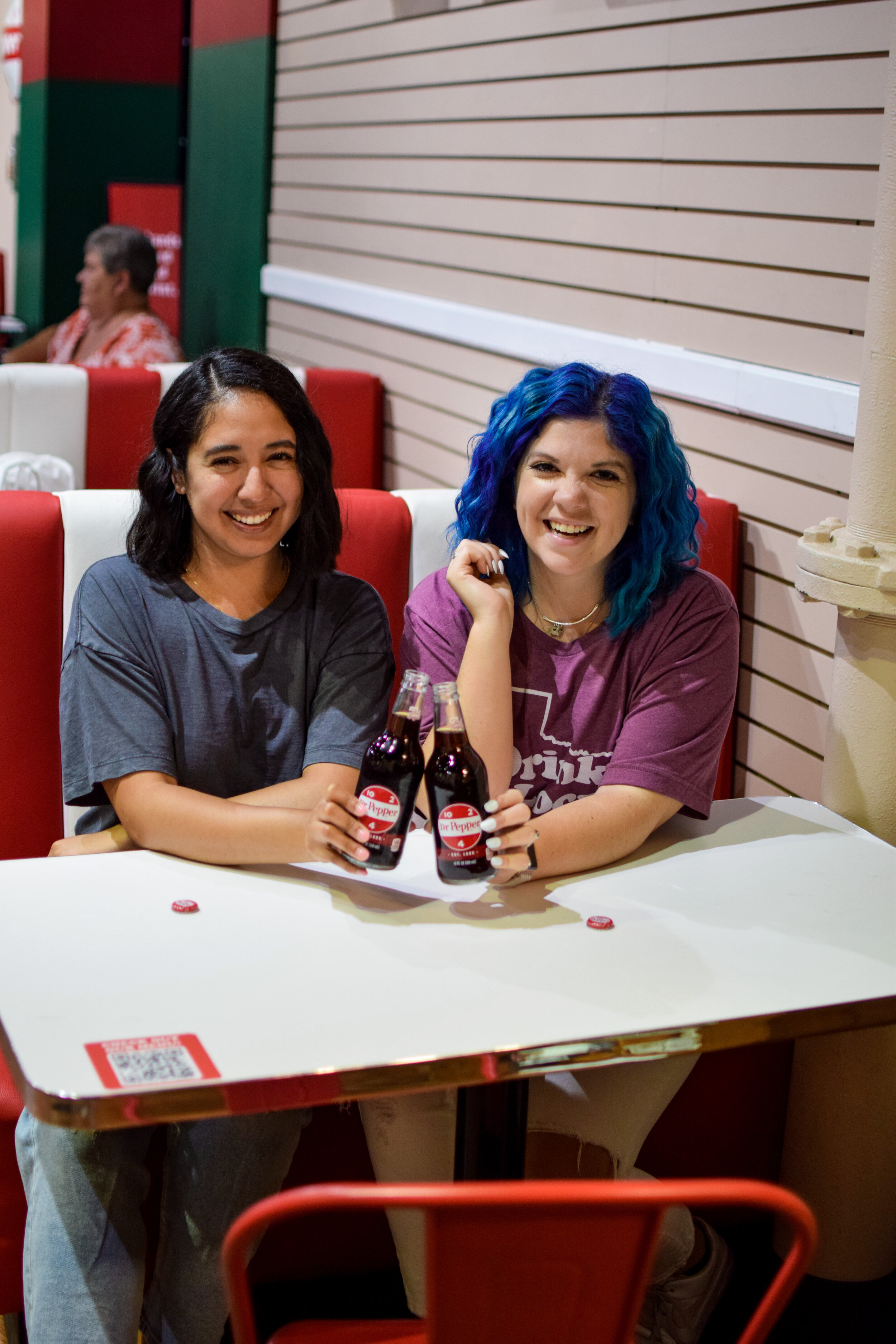 two women enjoying a drink at the Dr. Pepper Museum in Waco, texas