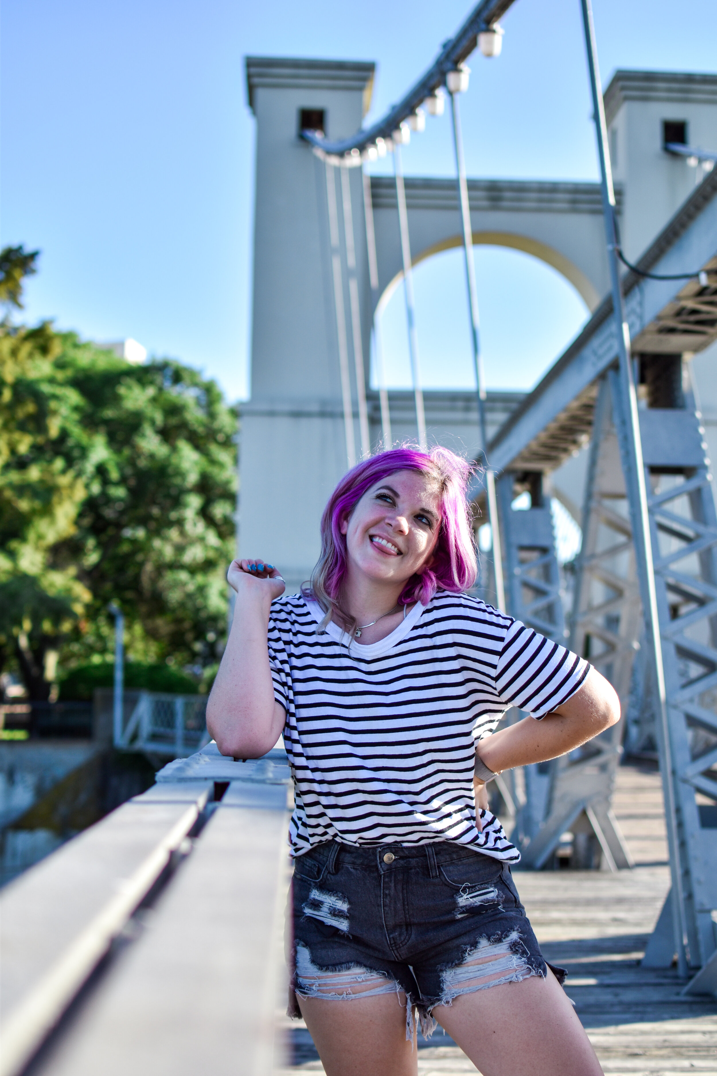 woman with purple hair smiling 