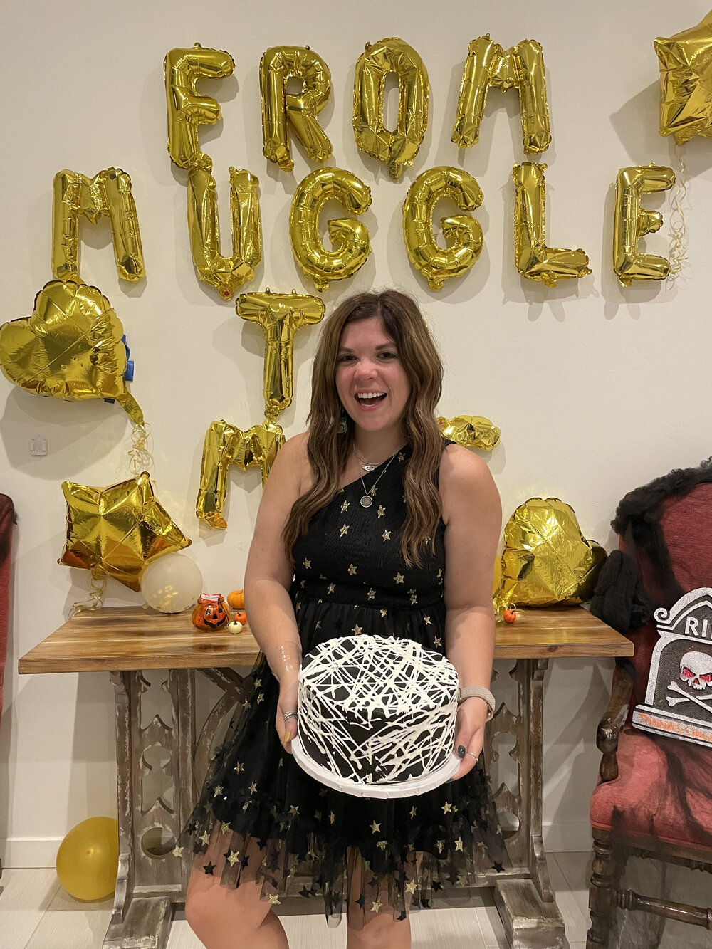 woman holding spiderweb cake for BACHELORETTE PARTY IN PALM SPRINGS