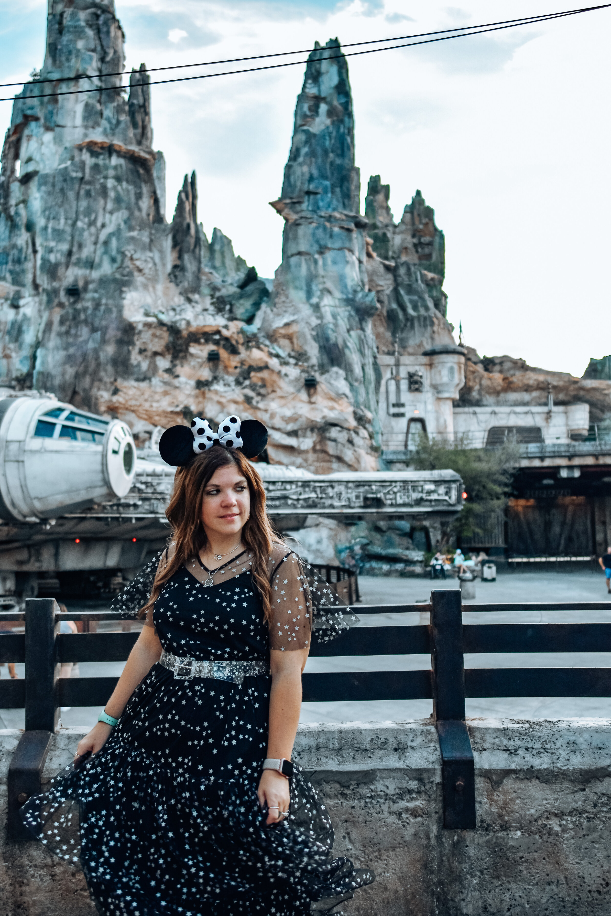 woman celebrating Halloween at Disney World and wearing polka dot dress