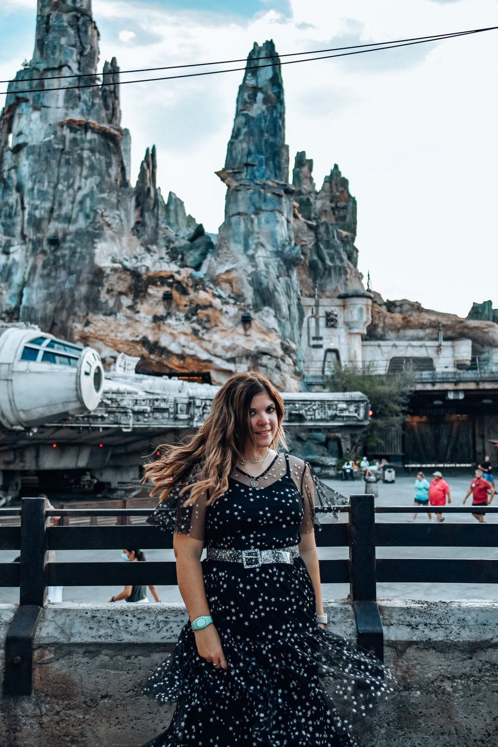 woman swirling celebrating Halloween at Disney World and wearing polka dot dress