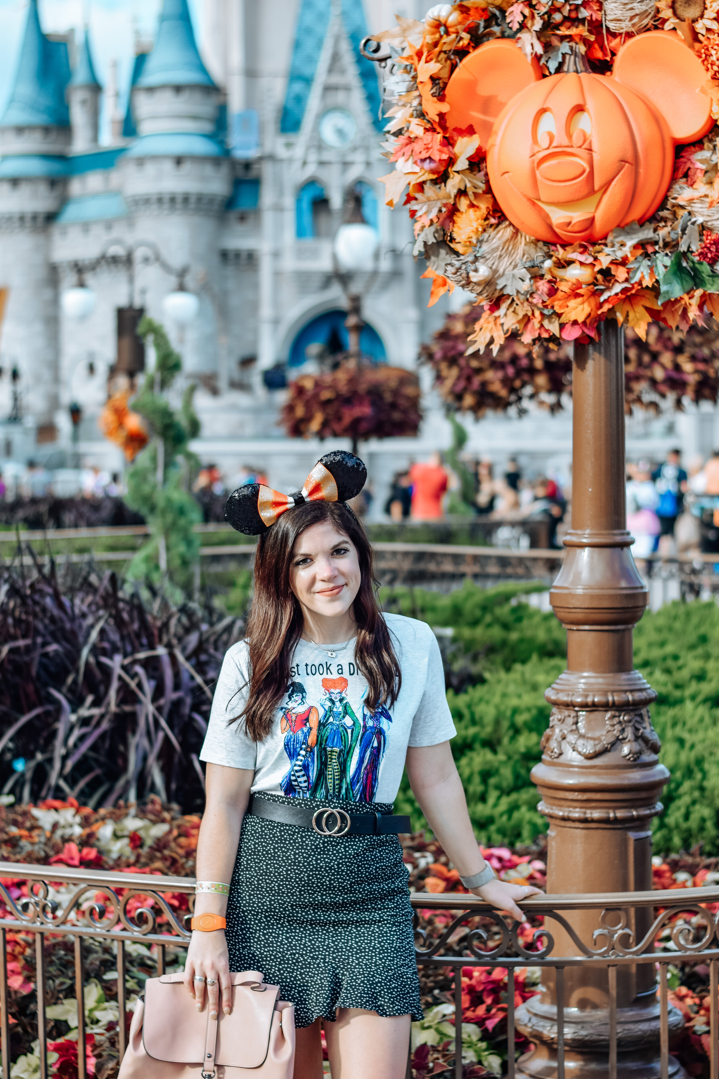 woman wearing white shirt and skirt celebrating Halloween at Disney World