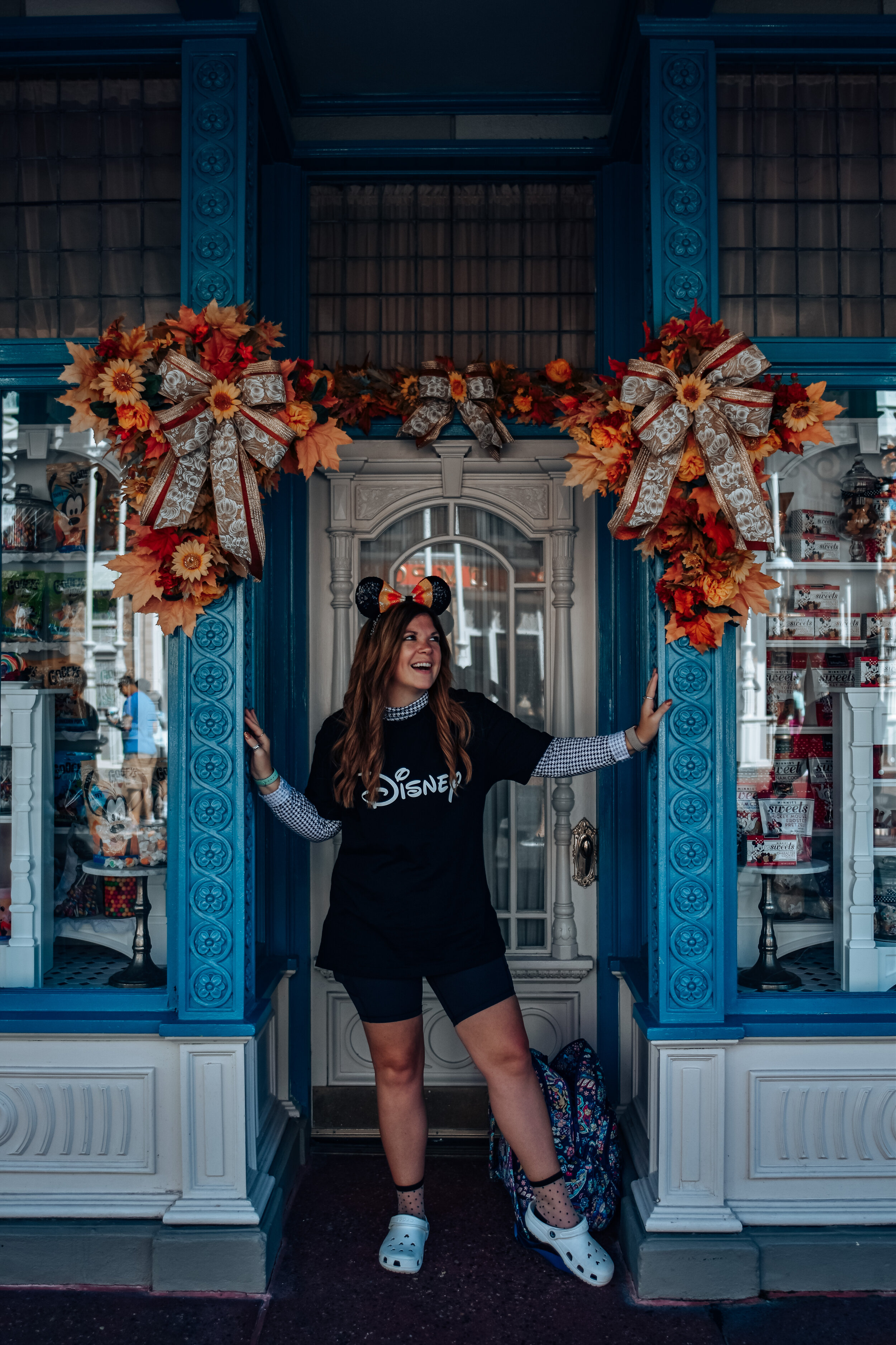 woman wearing black disney shirt celebrating Halloween at Disney World