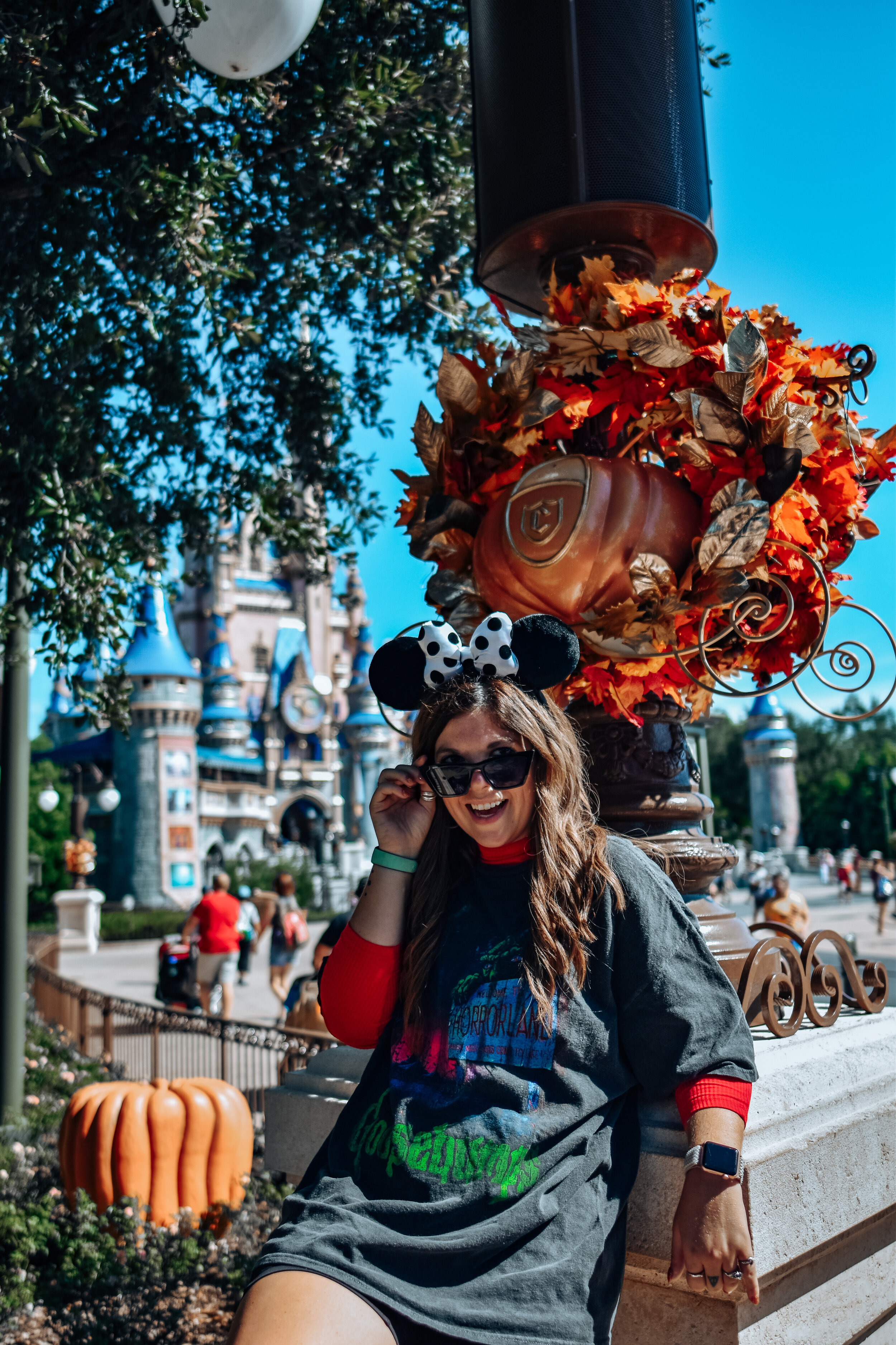 woman in all black outfit and celebrating Halloween at Disney World