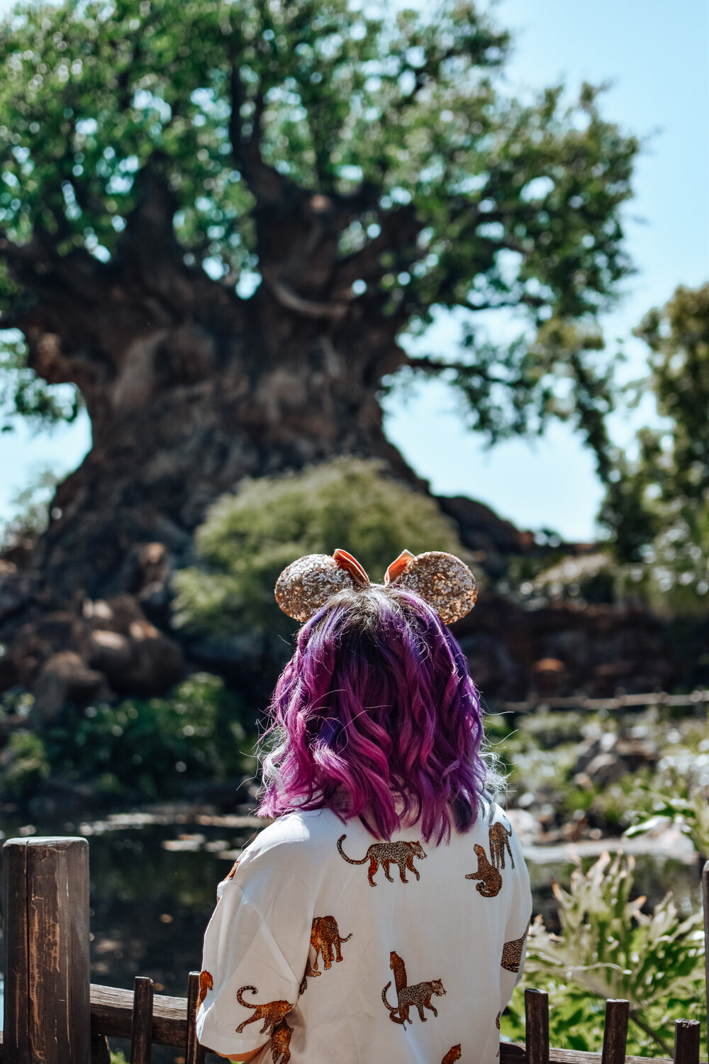 woman with purple hair and wearing OUTFIT INSPIRATION FOR ANIMAL KINGDOM 