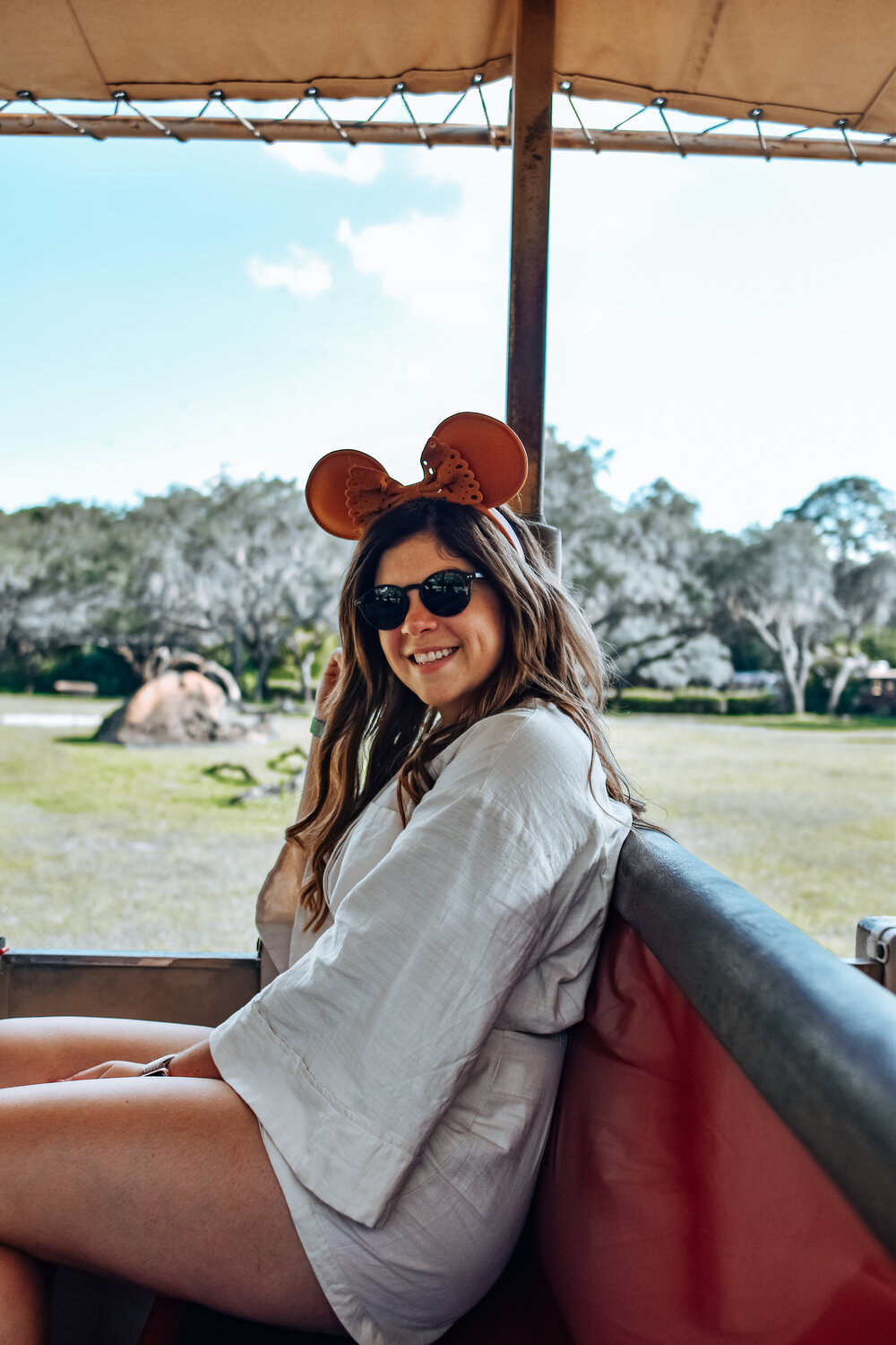 woman in safari ride and wearing oversize shirt