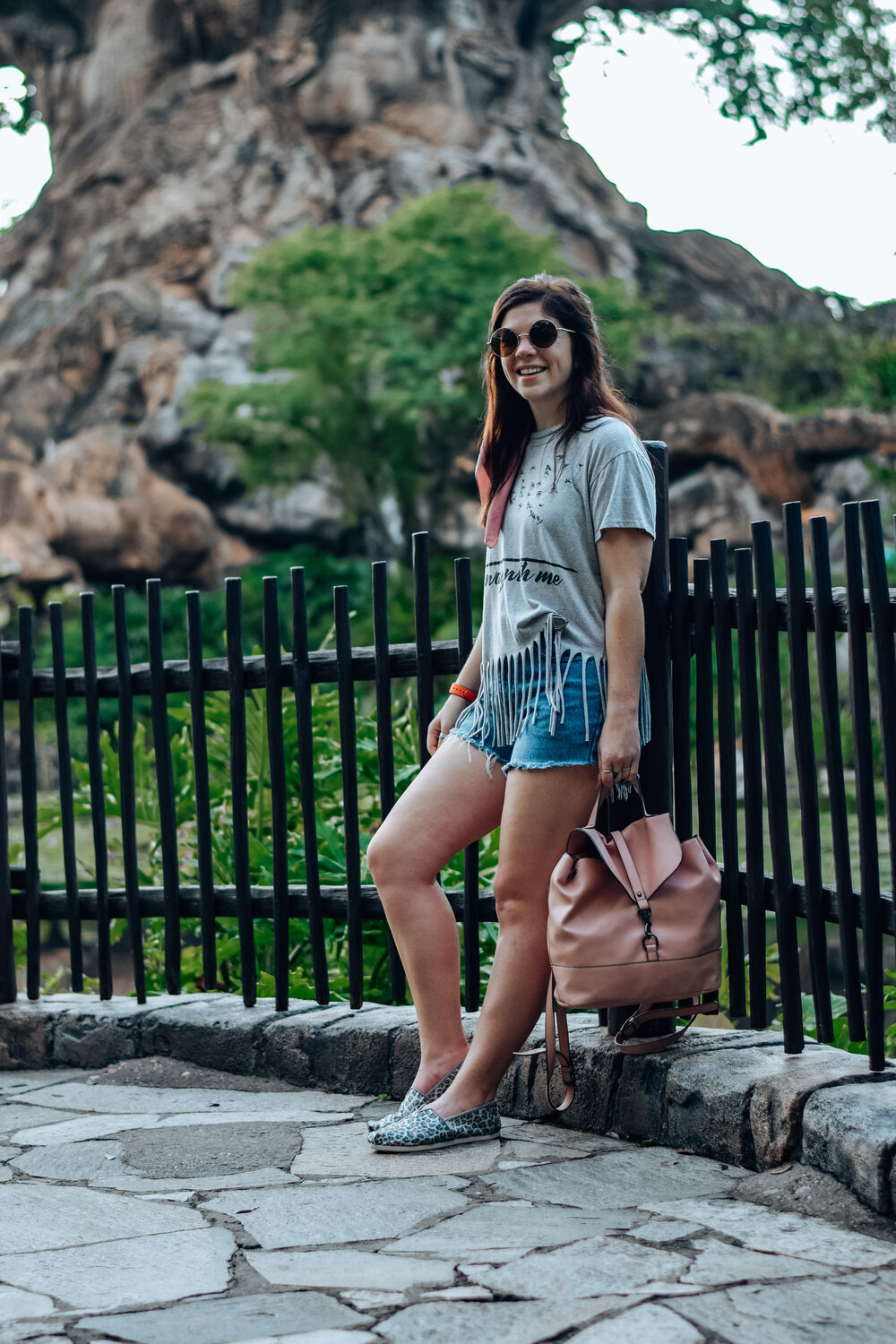 OUTFIT INSPIRATION FOR ANIMAL KINGDOM in denim shorts and fringe top