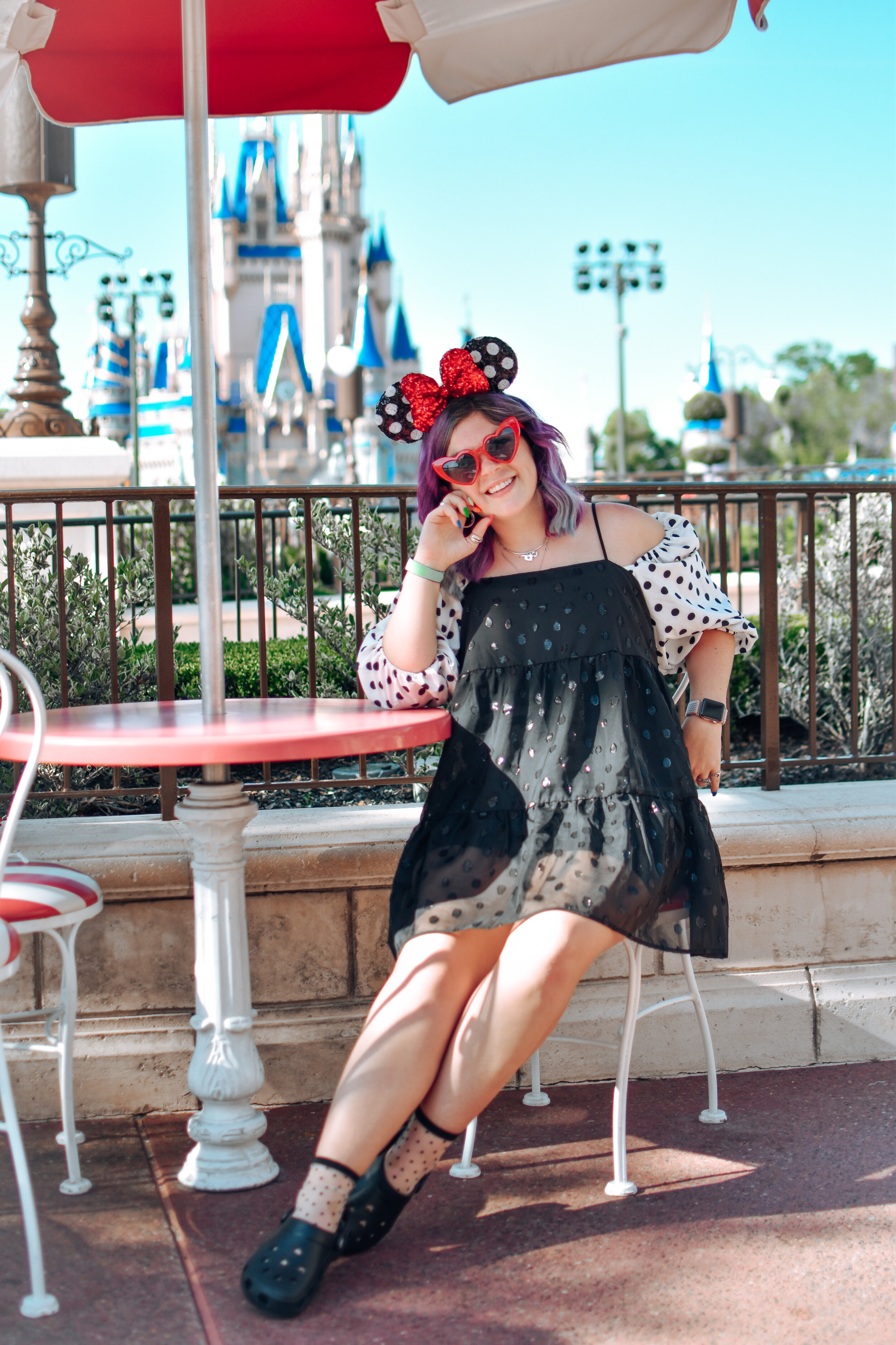 woman wearing polka dot dress for outfits for disney park