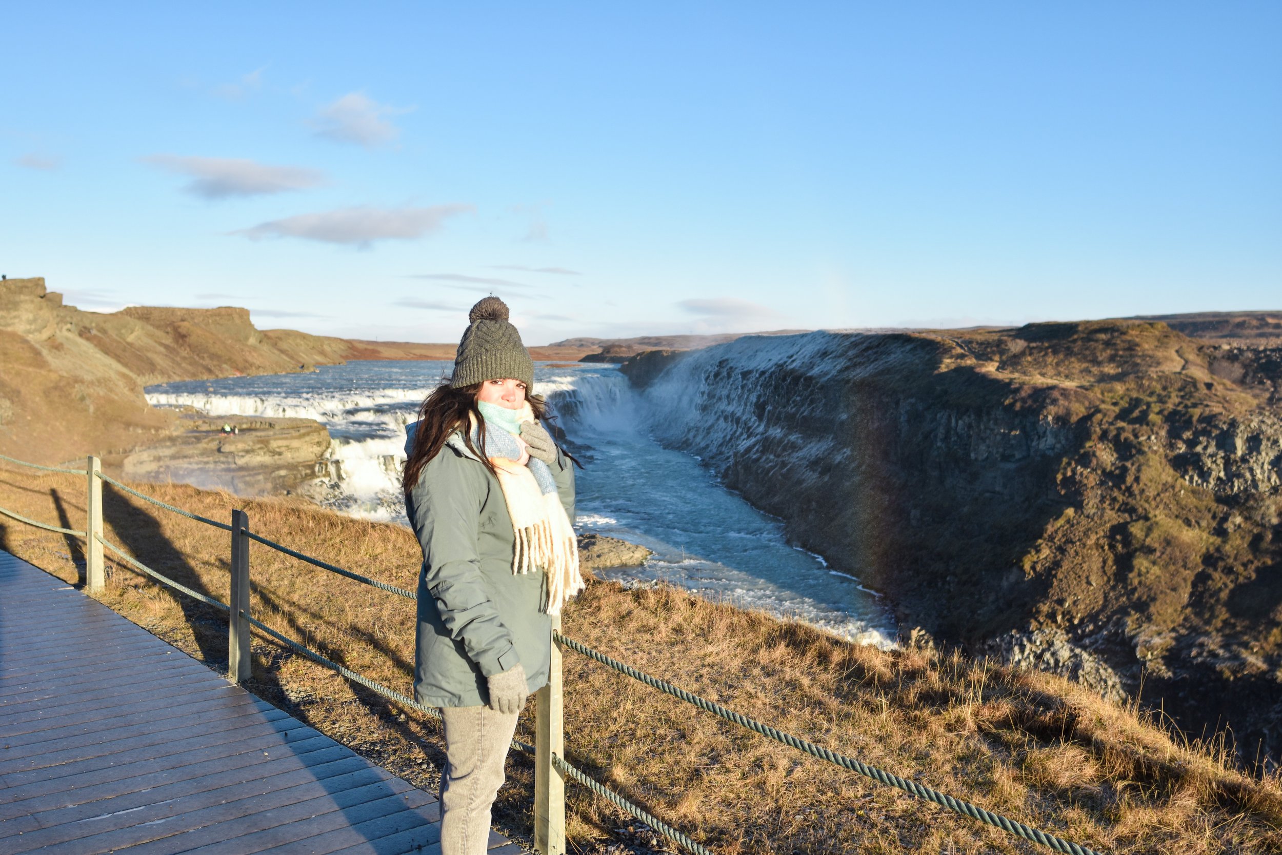 woman looking at the Gullfoss Waterfall