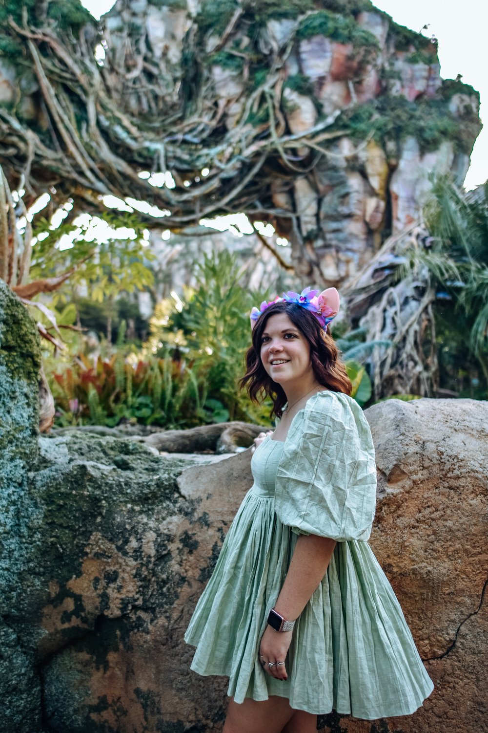 woman in green dress and animal ears headband for OUTFIT INSPIRATION FOR ANIMAL KINGDOM 