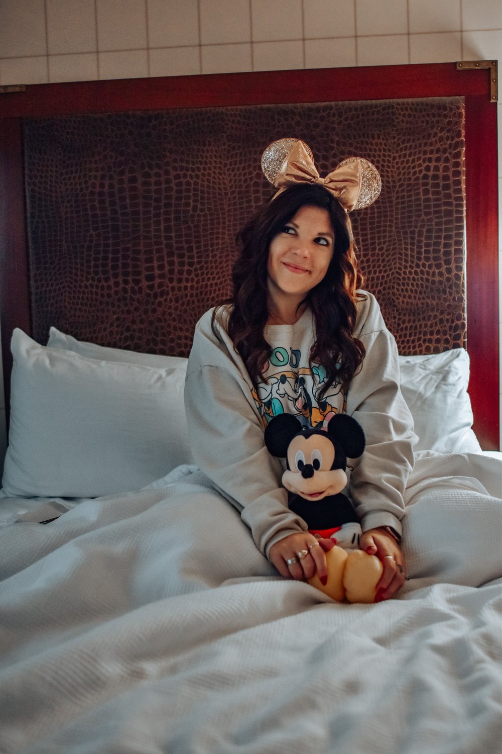 best hotel to stay in disneyland hotel lulu woman in bed