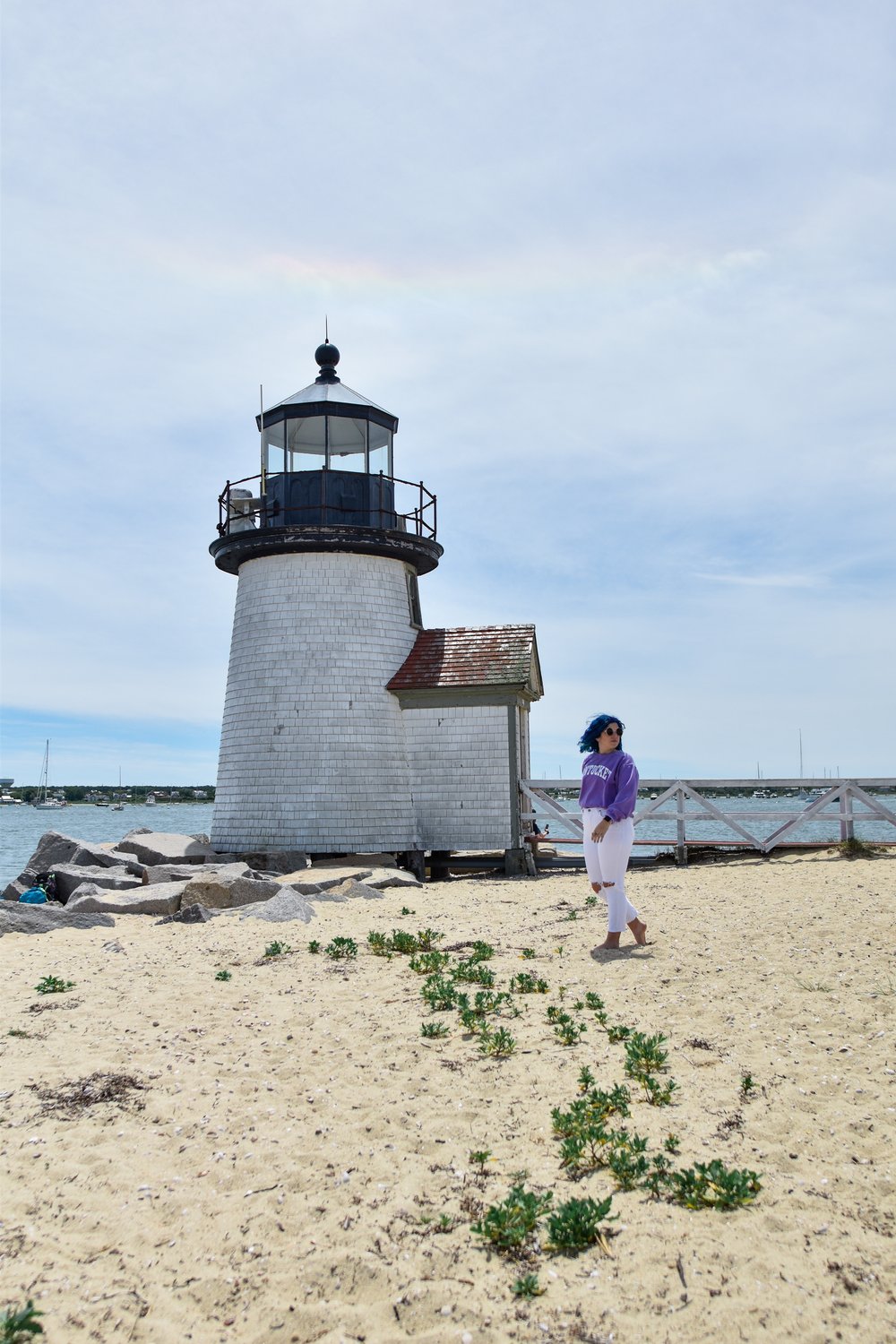 woman getting a photo at the lighthouse in NANTUCKET ISLAND