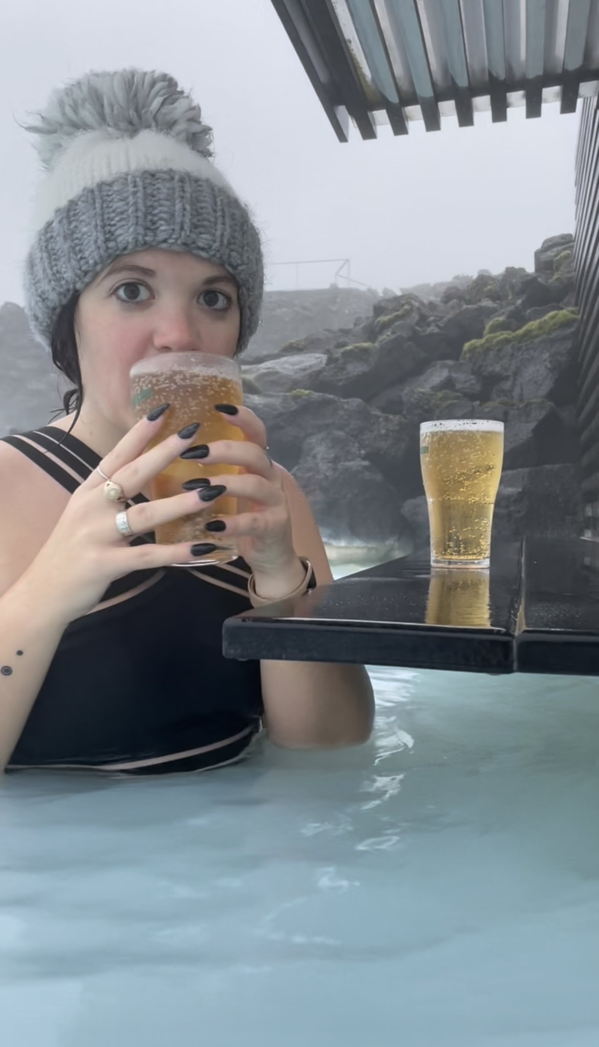 woman drinking beer at BLUE LAGOON IN ICELAND
