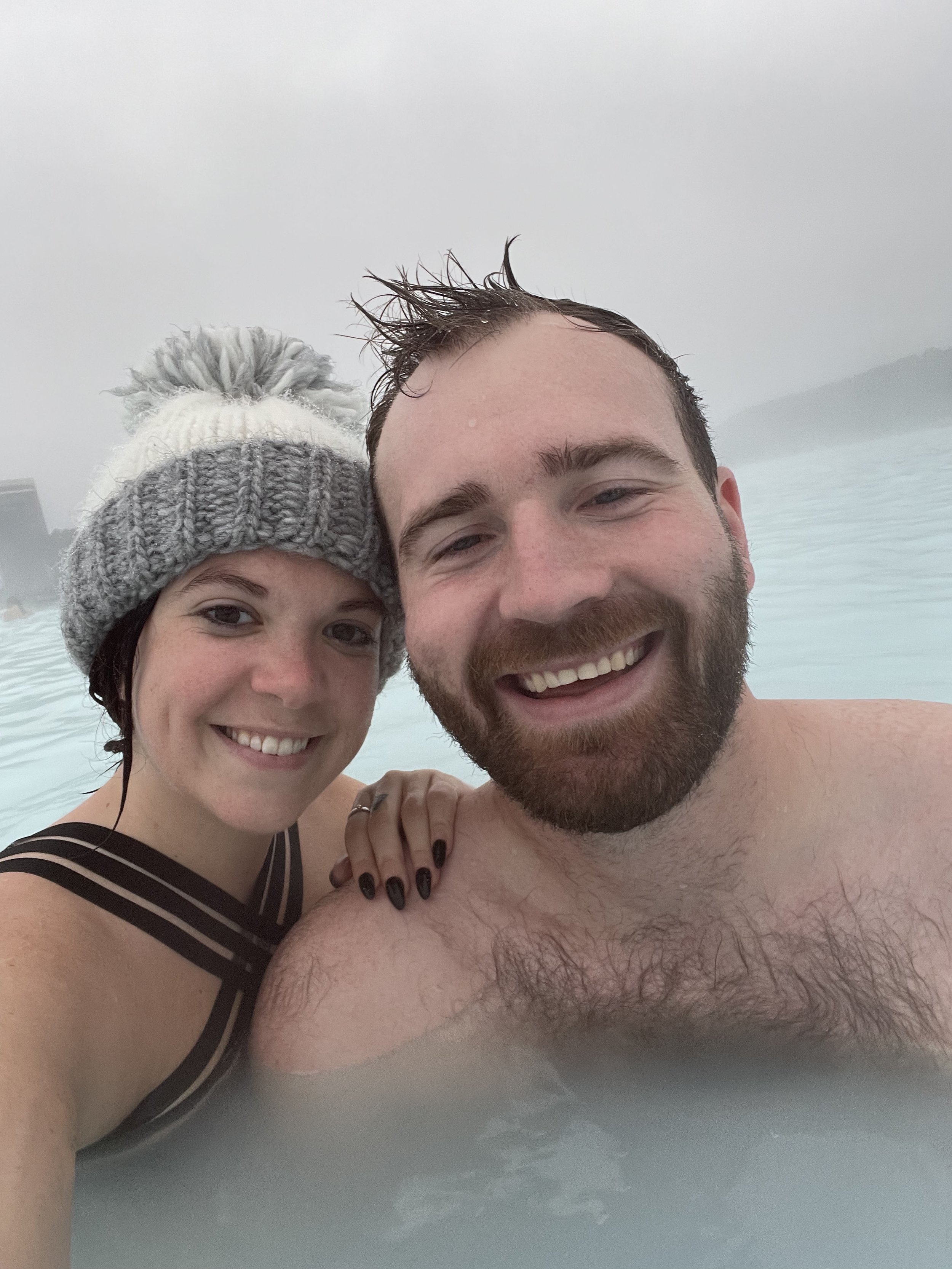 couple taking selfie at blue lagoon at REYKJANES PENINSULA