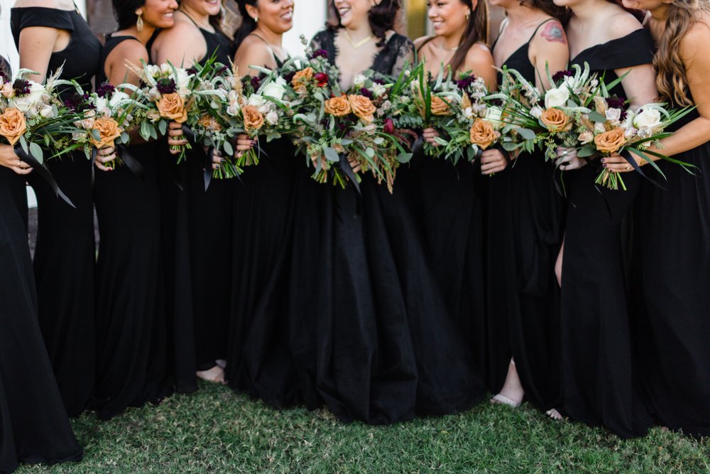 bridesmaids wearing black dresses for fall wedding 
