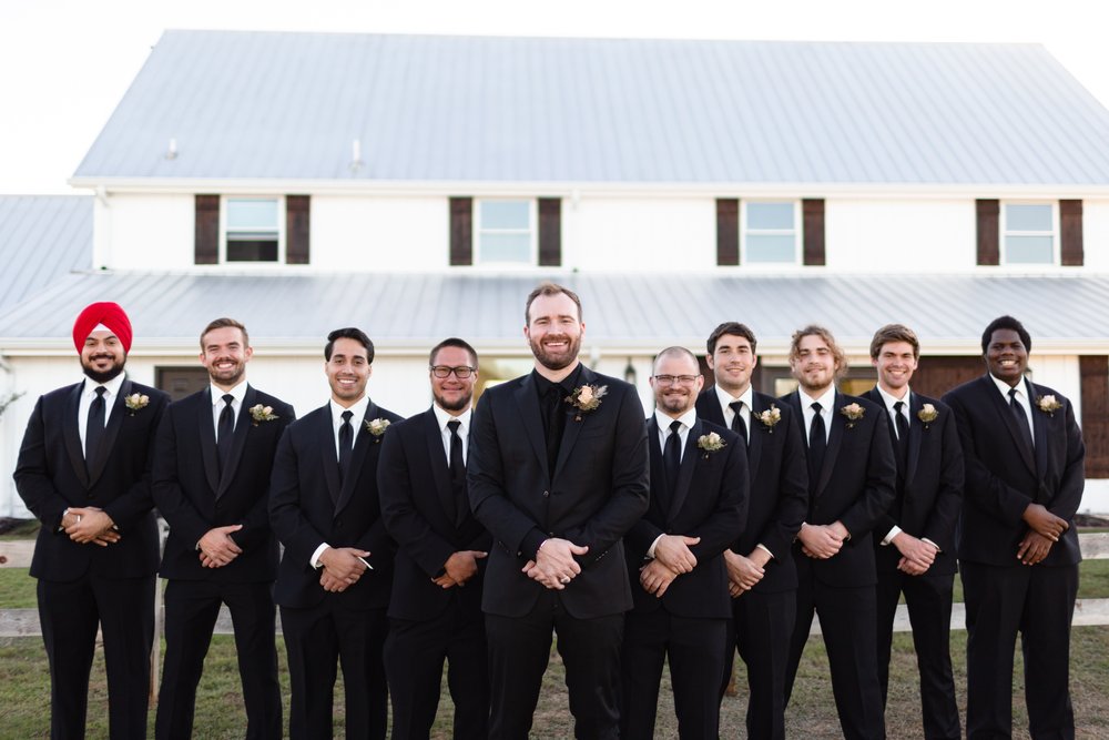groom and grooms men in all black for fall wedding