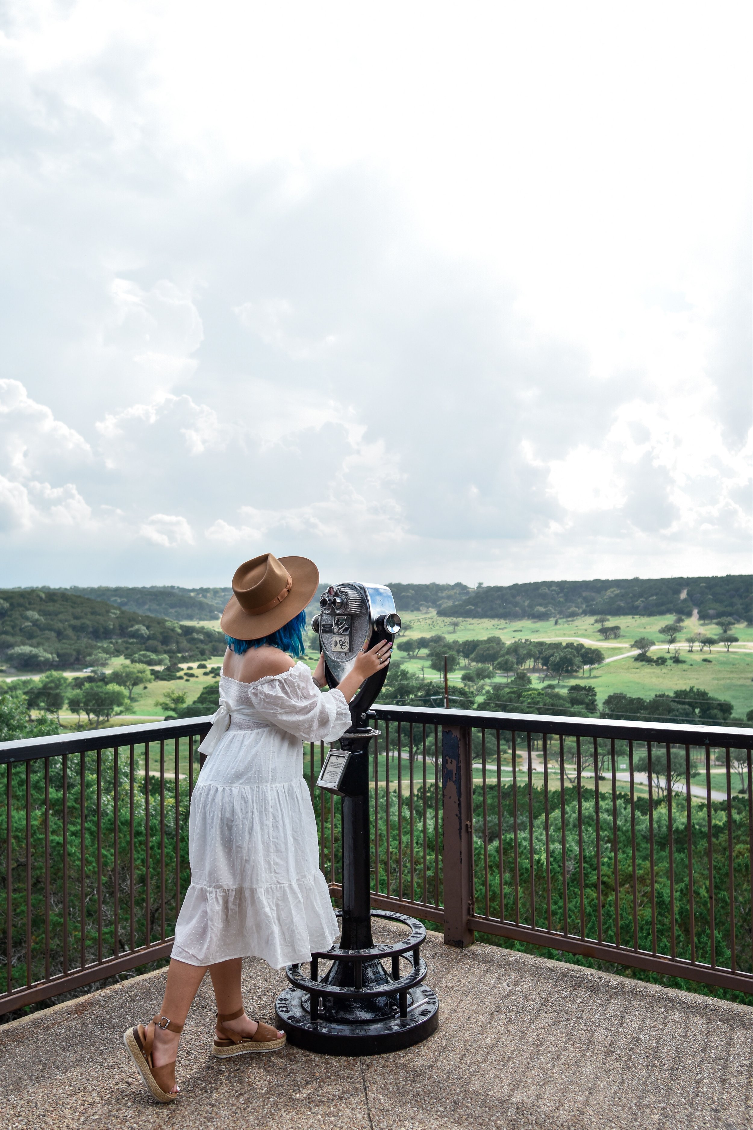 woman at the view deck of FOSSIL RIM WILDLIFE CENTER at Glen Rose, Texasv