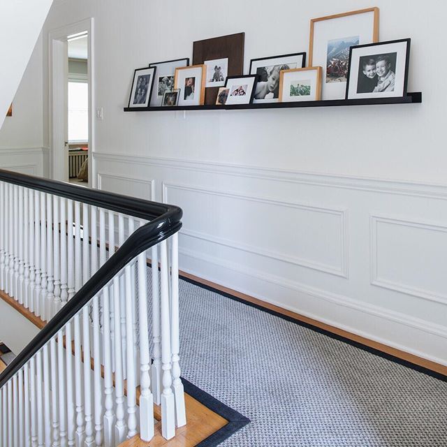 We love making homes with &ldquo;good bones&rdquo; even better. Believe it or not, this pretty Georgian-style home didn&rsquo;t always have this wainscoting, nor a high-gloss black railing. Now with the white millwork and walls coupled with the paint