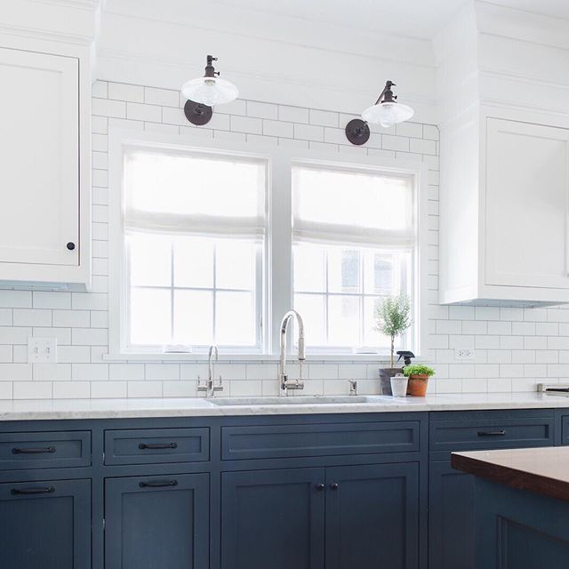 Doing some meal planning and daydreaming about this bright white and blue kitchen we did a few years ago. Still love those milk glass sconces. Are you cooking up a storm or ordering in? 🤔 | 📷 @stofferphotographyinteriors #hogankellydesign #onthebal