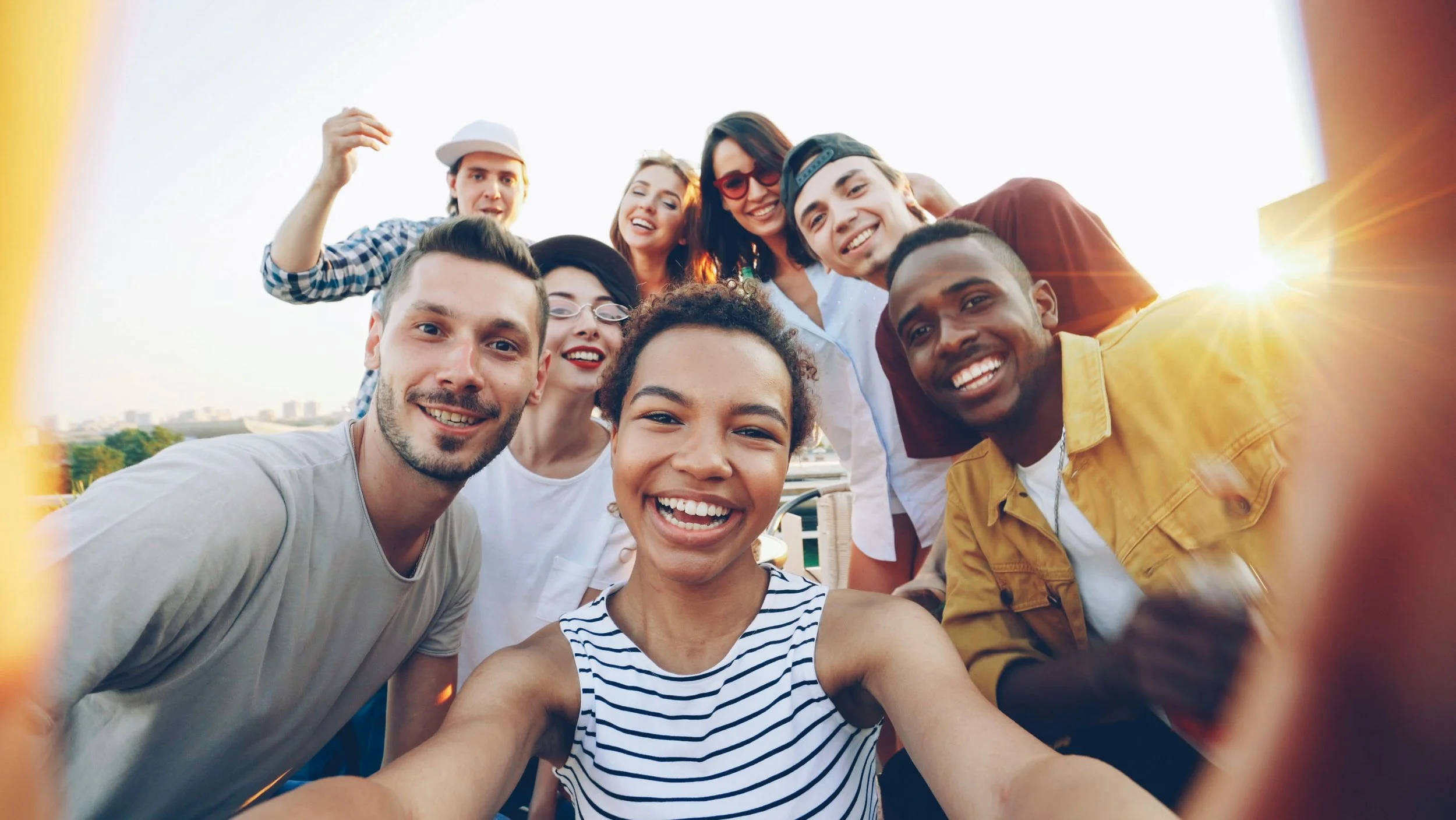 Diverse group of friends smiling together, representing hope and community after faith-based anxiety counseling in Spring Branch, Houston