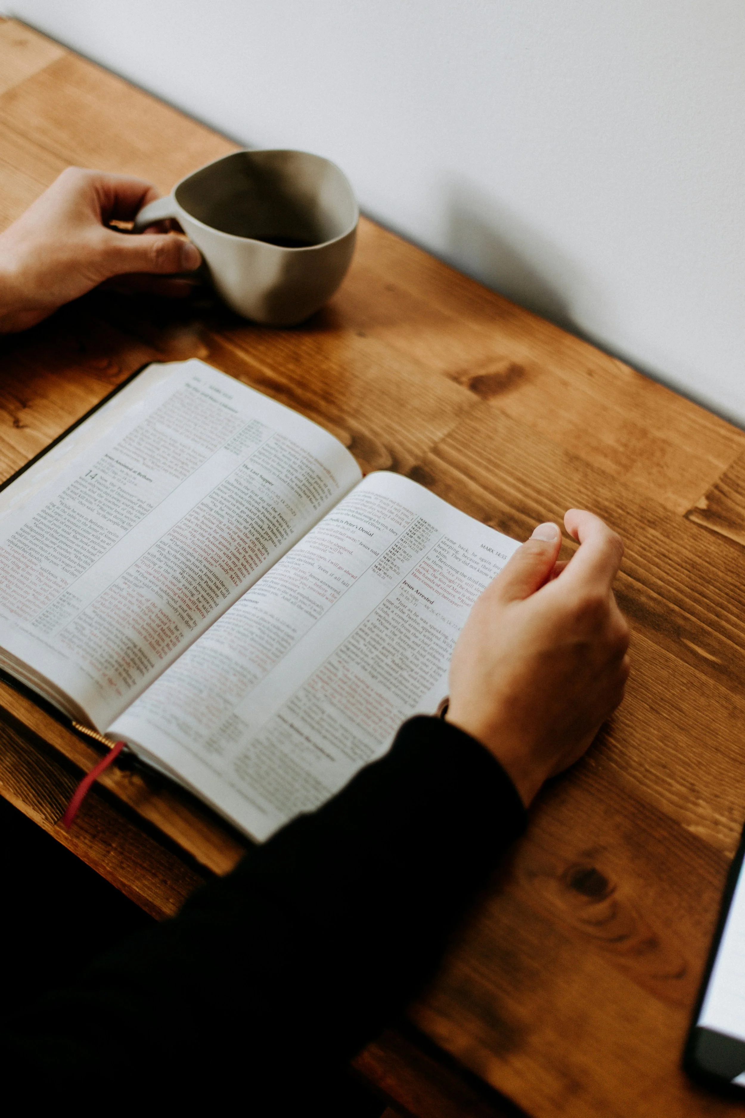 Open Bible and coffee representing faith integrated with evidence-based Christian therapy for anxiety