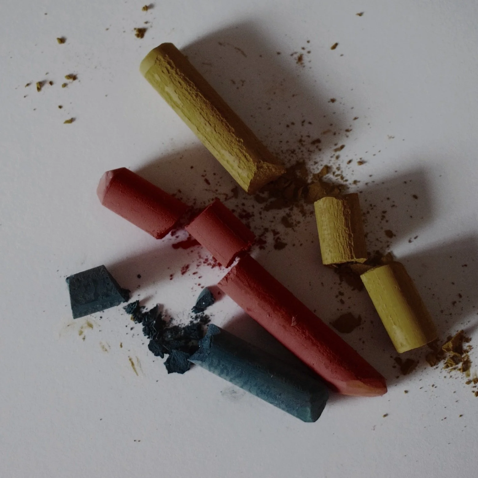 Three broken crayons representing unresolved trauma