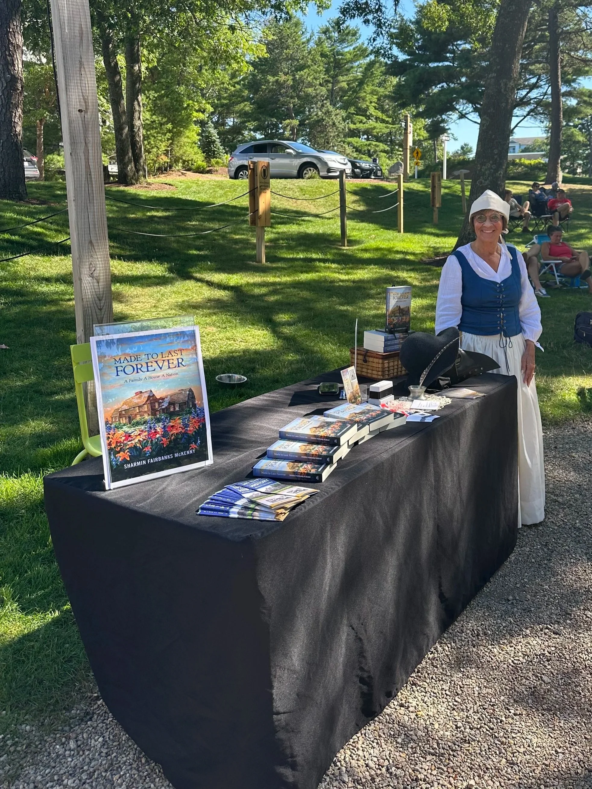 Sharmin F. McKenny 1600s costume with book display for Book Love Pine Hills
