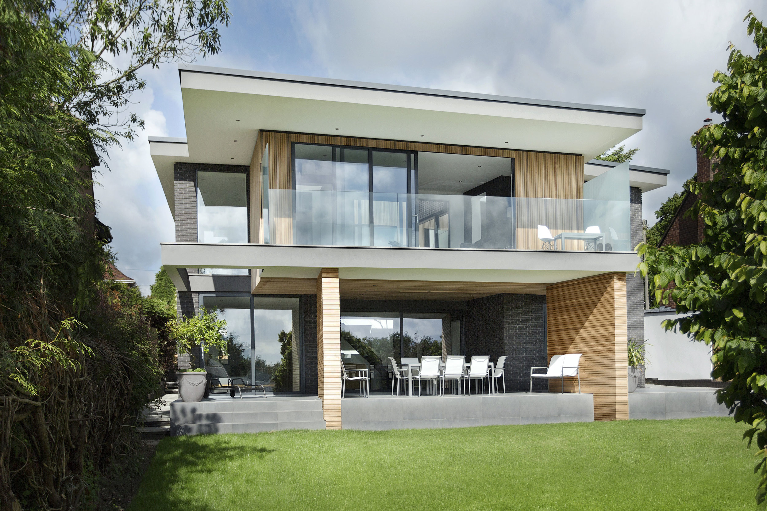 Situated in a prominent location overlooking the City Of Winchester, this luxury four bedroom house enjoys expansive views over the city and into its beautiful surrounding countryside. The design concept aims to maximise the views, by giving each key room a significant outlook across the landscape whilst resisting the standard domestic layout and adopting an “upside-down” living style. This splits the building into two halves; public, and private, which in turn separates the views into extended (over the landscape) and contained (over the garden).