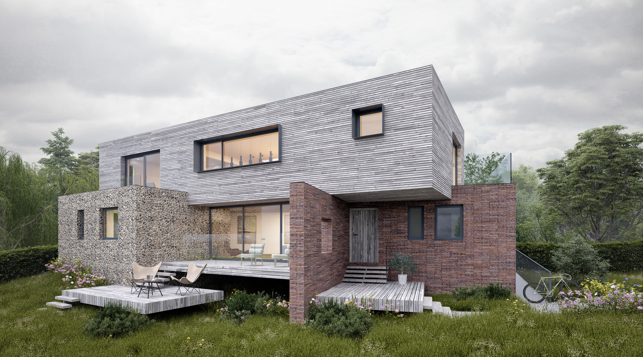 The existing two storey house at Five Elms does not take advantage of the site’s opportunities and is subject to flooding. The brief required AR Design Studio to embrace and challenge these issues within the protected surroundings of Bosham. The narrative for the scheme came from within the local context, in the form of a Rap-tackle Grade II listed 18th century warehouse, planted in the water of Bosham Quay. This building, typical of its context, uses solid brick plinths to raise the building above water level, protecting and supporting an inhabited timber clad form. We have translated this rationale to our site where flooding commonly occurs, raising the proposed 300sqm four bedroom house off the ground to allow flooding beneath. From the elevated ground floor, decking steps down to the landscape, whilst from an elevated perspective, the site also hosts uninterrupted views. This in turn has informed the concept of an upside-down house, private rooms inhabiting the solid plinths at ground floor to raise the first floor timber form, its open plan layout and balconies taking advantage of the views overlooking the surrounding farmland. The concept of the Rap-tackle warehouse was continued through to the material palette, where solid materials of flint and a contemporary linear brick were chosen for the ground floor, supporting the light weight timber first floor form, reflecting the blend of traditional red brick and natural hues in the surrounding area. As such the proposed house makes use of references and materials found in Bosham itself and across the surrounding countryside, whilst the brief has challenged the design to create a one-off contemporary design, enhancing the architectural distinctiveness of the area.
