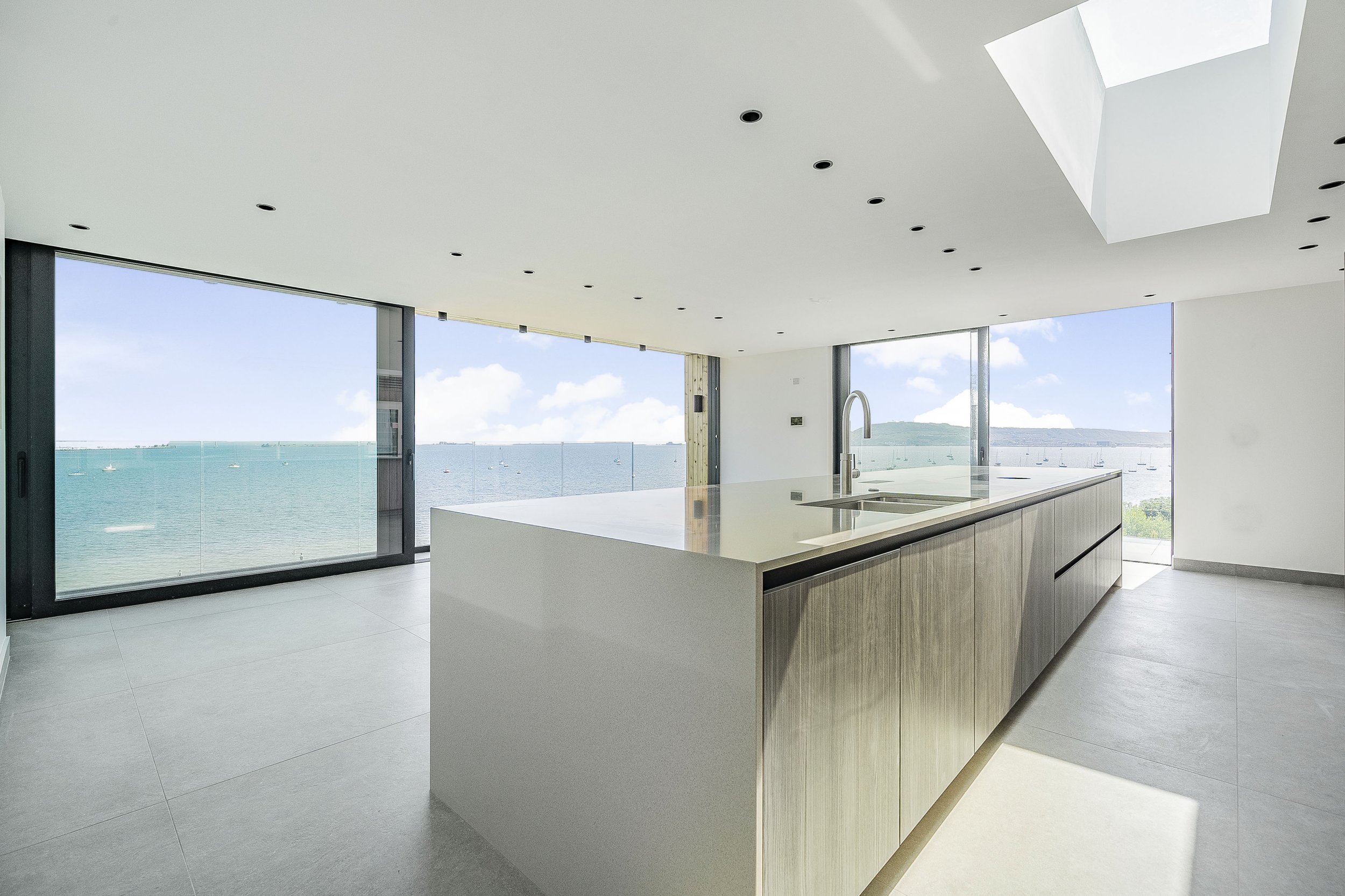 The Portland View homes are constructed with a commitment to sustainability and energy efficiency. Built to exceed building codes, each house features double the insulation required by regulations, creating a highly airtight structure. This "fabric-