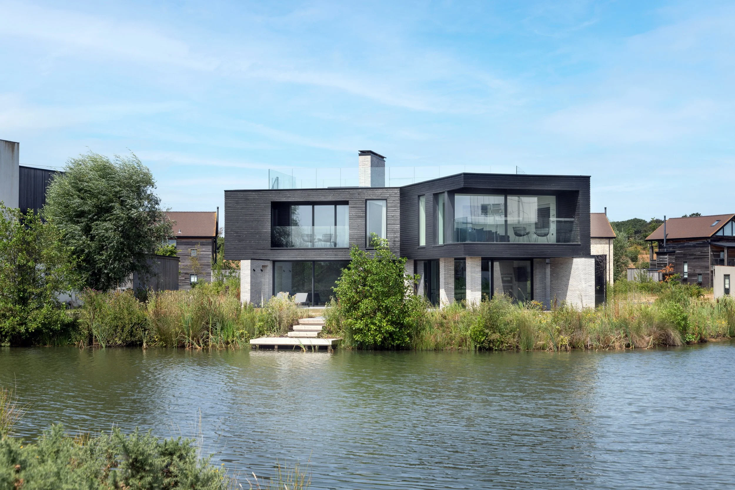   A Retreat Between Land and Water   Designed by award-winning AR Design Studio, this highly sustainable four bedroom retreat is conceived as a sanctuary for family and&nbsp;friends,&nbsp;a place where architecture, landscape and water&nbsp;come toge