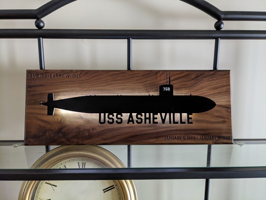 I love love love unique and meaninful projects. This one was for a Fathers day gift. The submarine is aluminum and stands off the walnut about 1/2in to allow the baklight to glow. The switch it up kn the hatch area and its all battery operated. #wood