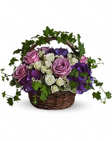 A Full Life Even in mourning it is important to remember and honor a life well lived. This beautiful basket of purple and white flowers blended with vibrant greenery is a wonderful way to pay tribute to one who has indeed lived a full life. Brilliant flowers such as purple hydrangea, lavender roses, white spray roses and waxflower are arranged with beautiful ivy and more in a lovely round basket. Buy Now>>