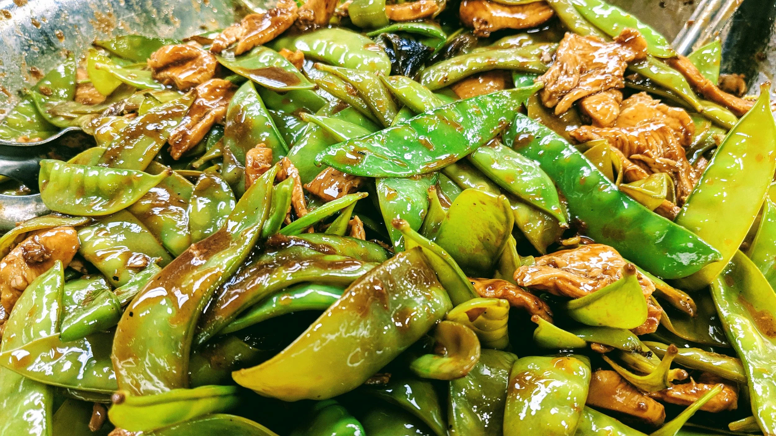 Chicken stir-fry with fresh veggies and homemade teriyaki sauce is a Guest favorite that is served on our menus every month.