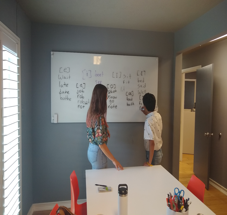 Iñigo and LanGo intern Marison working on IPA vowel symbols and corresponding example words.