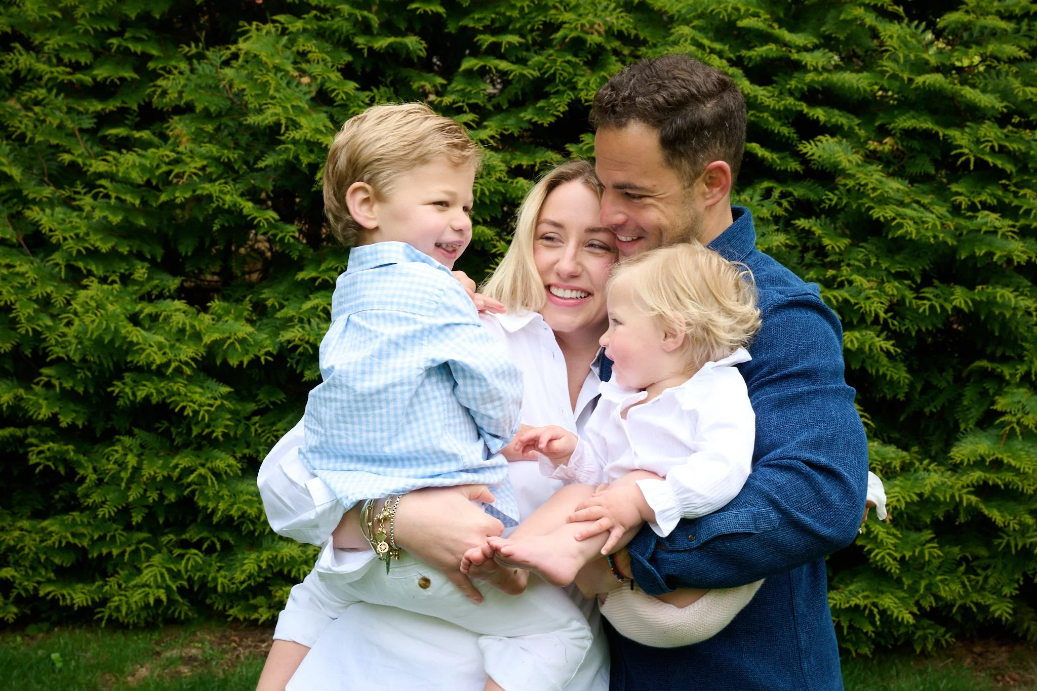  Greenwich CT family hugging in their backyard photo session with Pamela Einarsen  