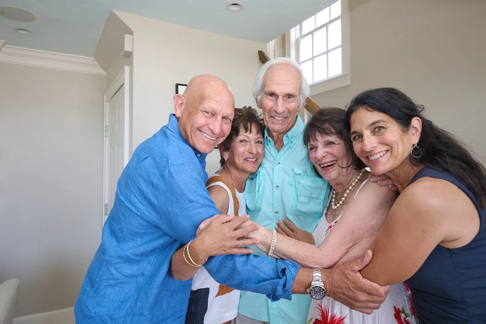 Family hugs at a Westport CT home with party photographer Pamela Einarsen