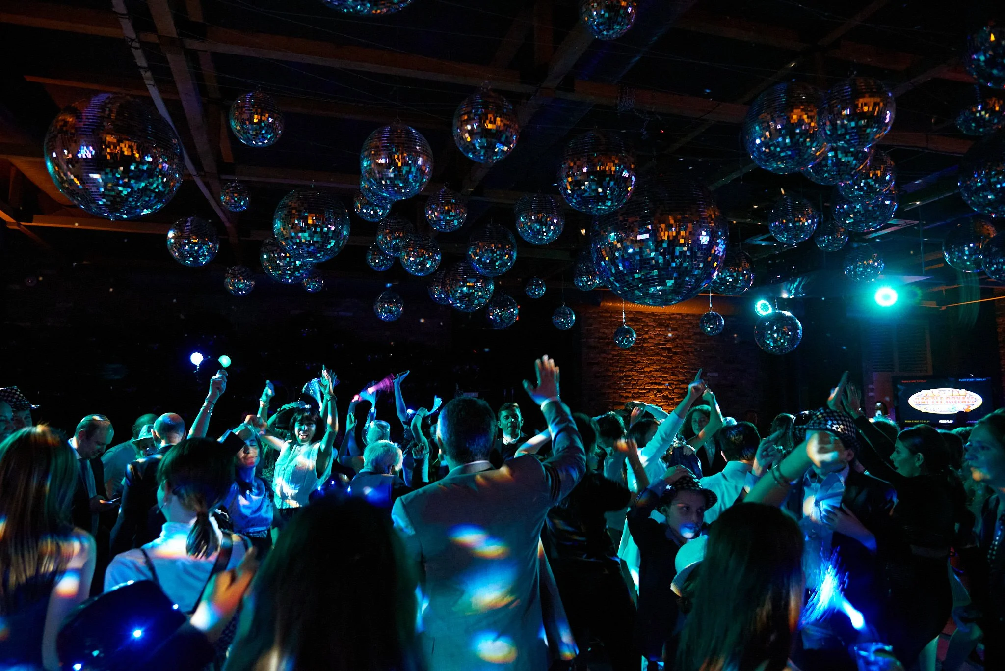 People party on the dance floor at an event in New York City, by photographer Pamela Einarsen.