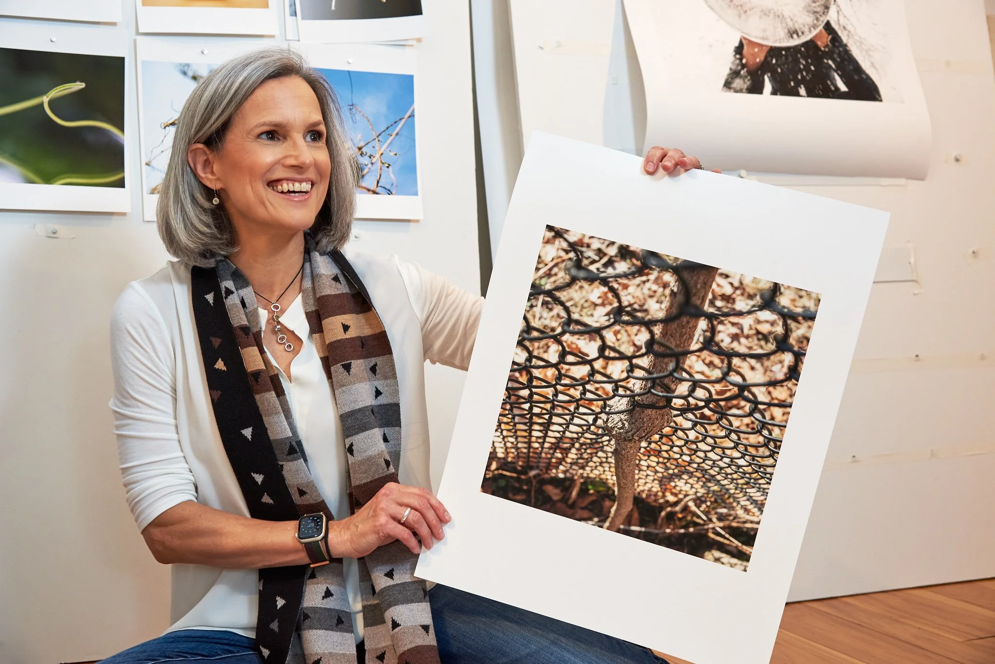 Photographer Torrance York shows a print at  a personal branding photo session in her New Canaan, CT studio.