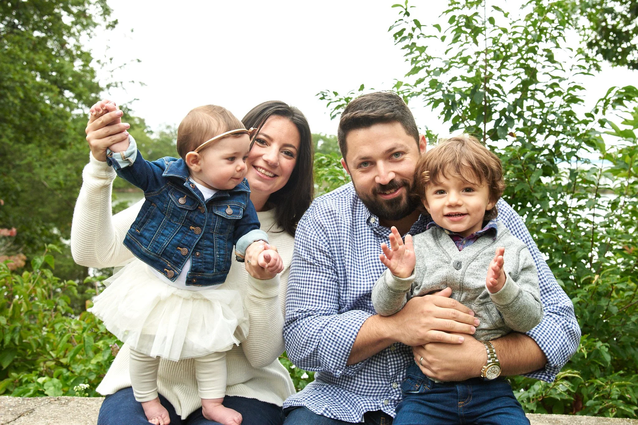 Family in Old Greenwich, CT smiles at lifestyle photographer Pamela Einarsen. 