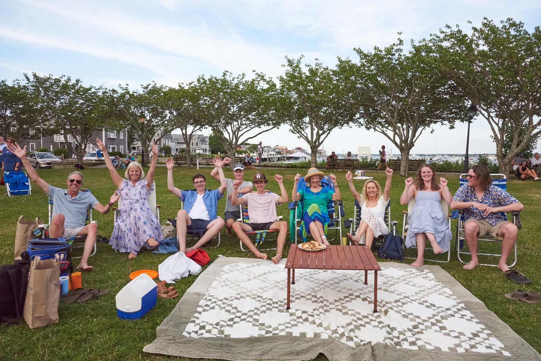 Family picnics at a park on Nantucket by lifestyle photographer Pamela Einarsen.