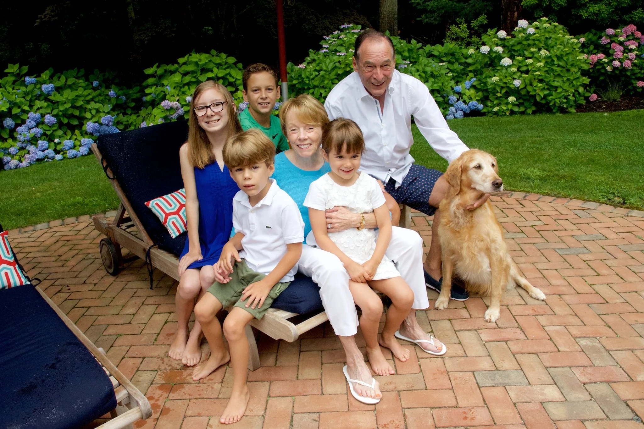 Family sits together at Hampton’s house by family photographer Pamela Einarsen.