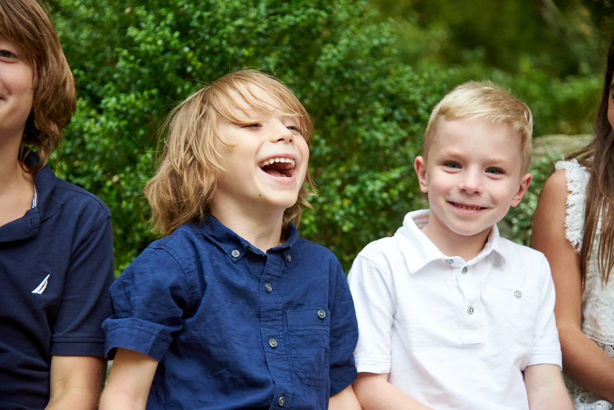 Boys laugh at extended family reunion in Weston, CT with family photographer Pamela Einarsen.