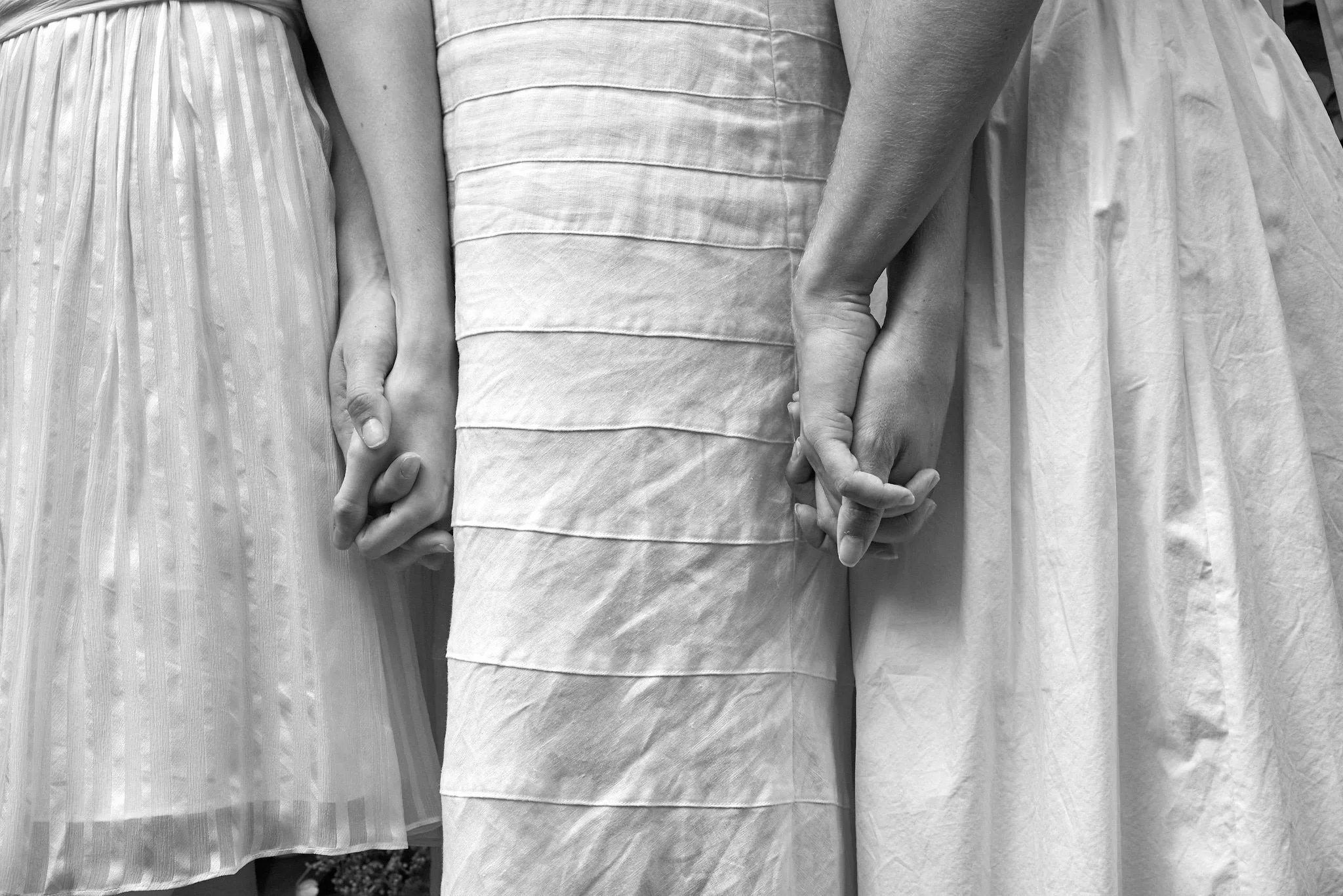 B&amp;W portrait of sister holding hands in Greenwich, CT by family photographer Pamela Einarsen.
