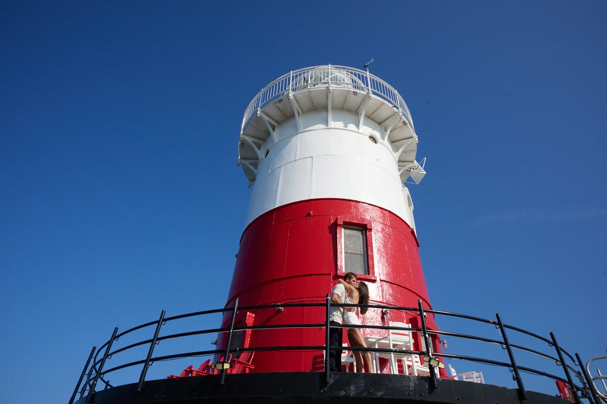 Newly engaged couple at Green Ledge Lighthouse in Rowayton CT by portal photographer Pamela Einarsen. 